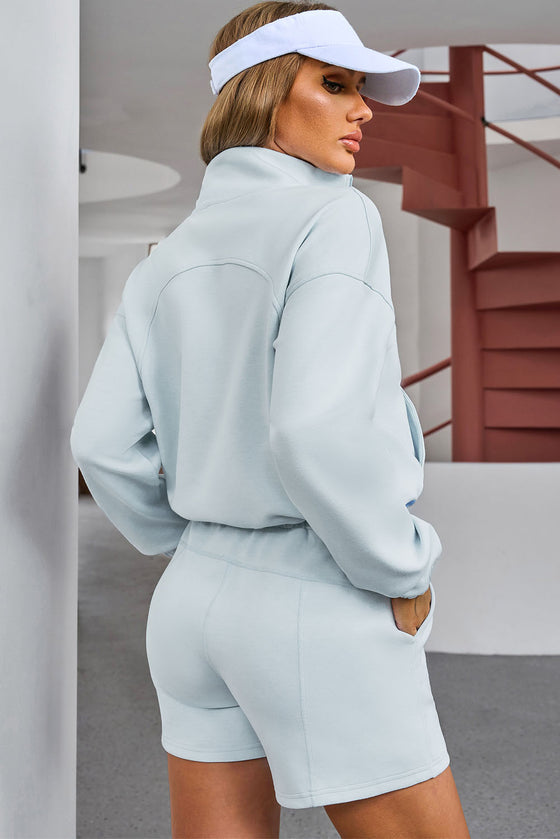 Sky Blue Solid Half Zip Pocketed Sweatshirt And Shorts Sports Set